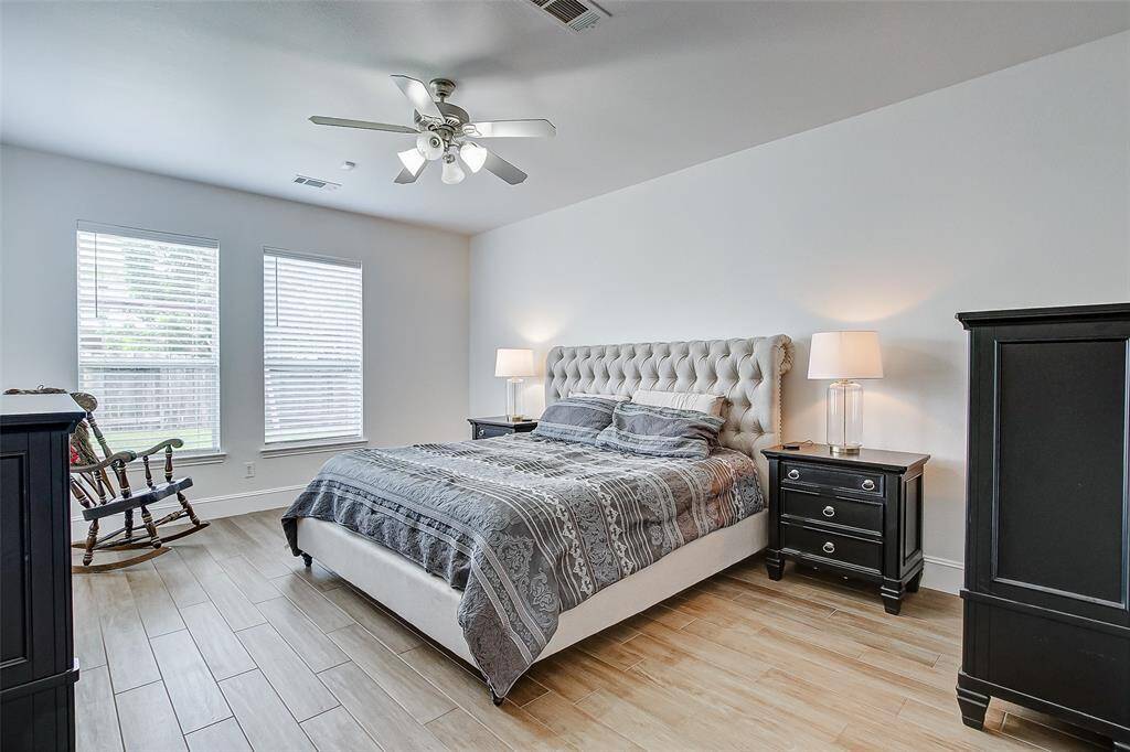 The first-floor primary retreat is a peaceful sanctuary designed for ultimate relaxation.