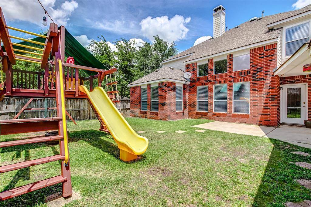 The patio provides plenty of space for outdoor living or dining, while the yard offers ample room for playground equipment or other outdoor activities.