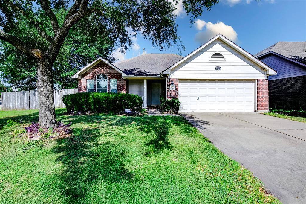 Welcome to 2703 Silk Tree Lane! This charming brick home sits on a generous corner lot framed by mature trees and well-manicured landscaping. The inviting curb appeal is enhanced by classic red brick, white trim, and a spacious 2-car garage, making a great first impression for your next home.