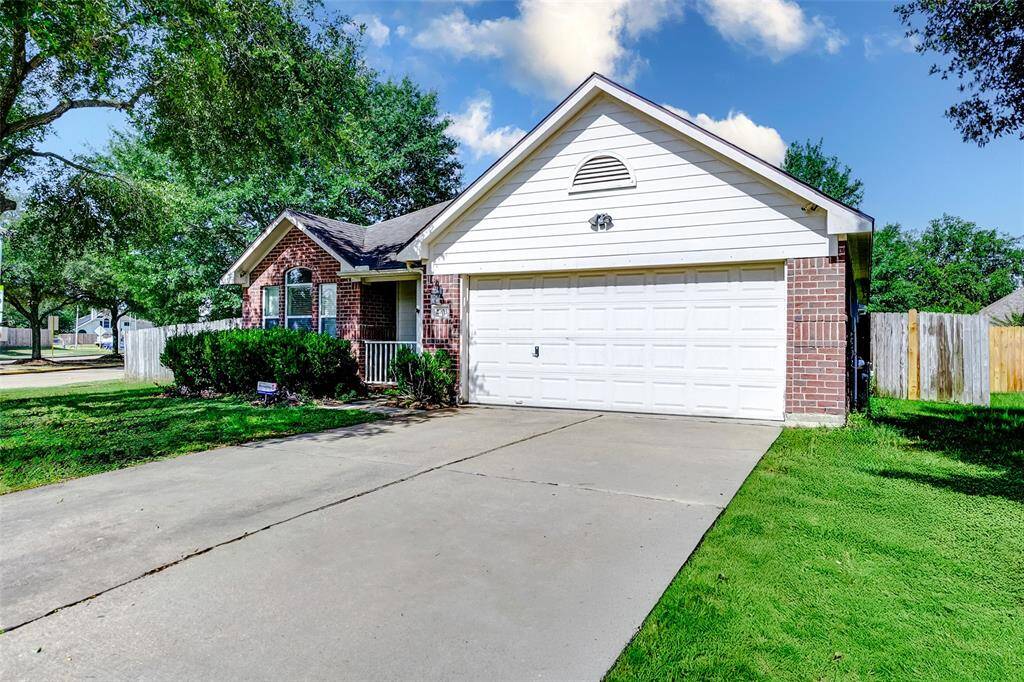 Enjoy the space and privacy of this oversized 9,740 sq ft corner lot. A long driveway, lush front lawn, and brick elevation provide timeless curb appeal. The large shade tree and covered porch add warmth and welcome to this single-story home in the heart of Katy.