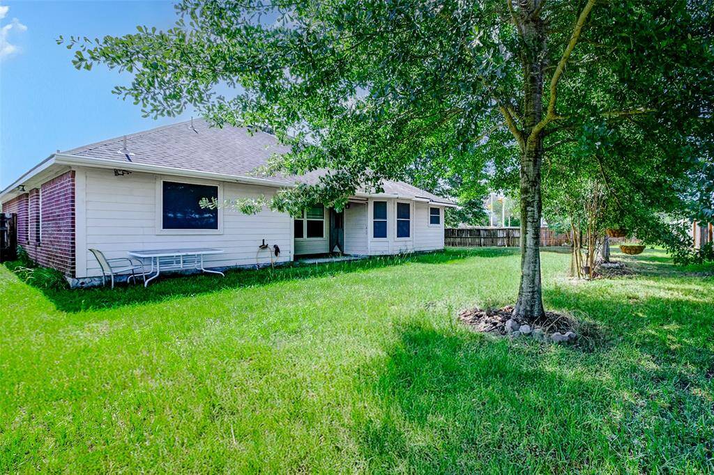Step out into a beautifully shaded backyard that offers both space and privacy. With mature trees, a covered patio area, and plenty of lawn for play or pets, this backyard is ideal for hosting BBQs or enjoying weekend relaxation.