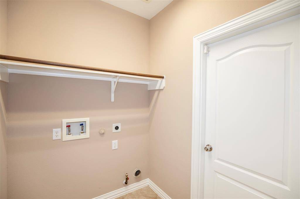 The utility room sits near the garage entrance.