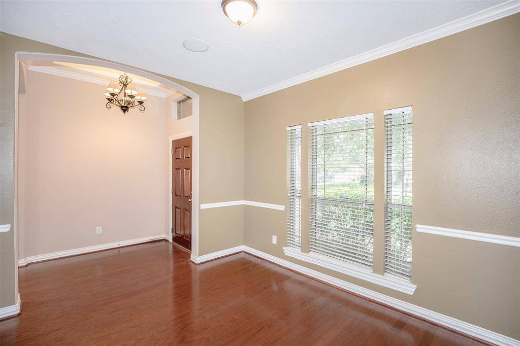 This versatile room is an ideal space for a stylish home office, a cozy sitting area, or even a formal dining room to suit your lifestyle.