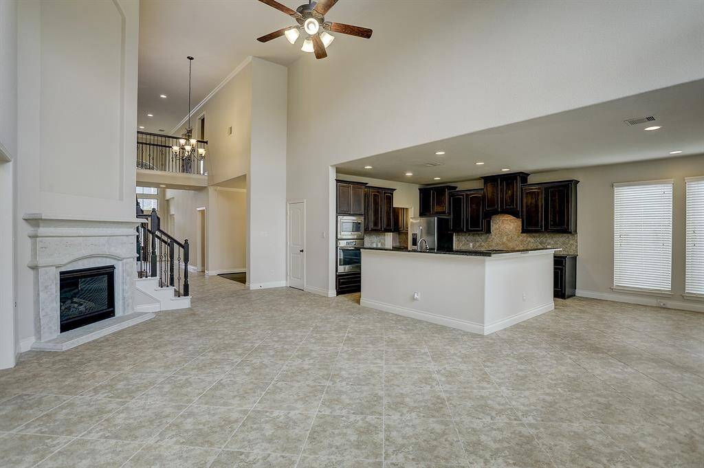 Cast stone fireplace in the 2 story living area