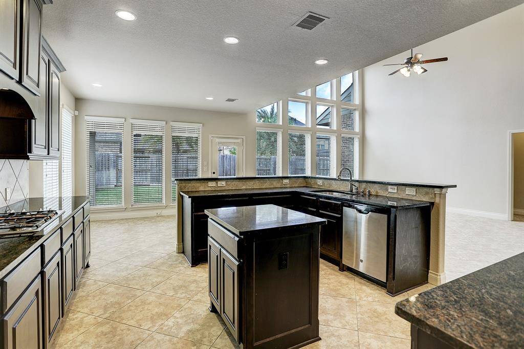 Large kitchen with multiple work surfaces