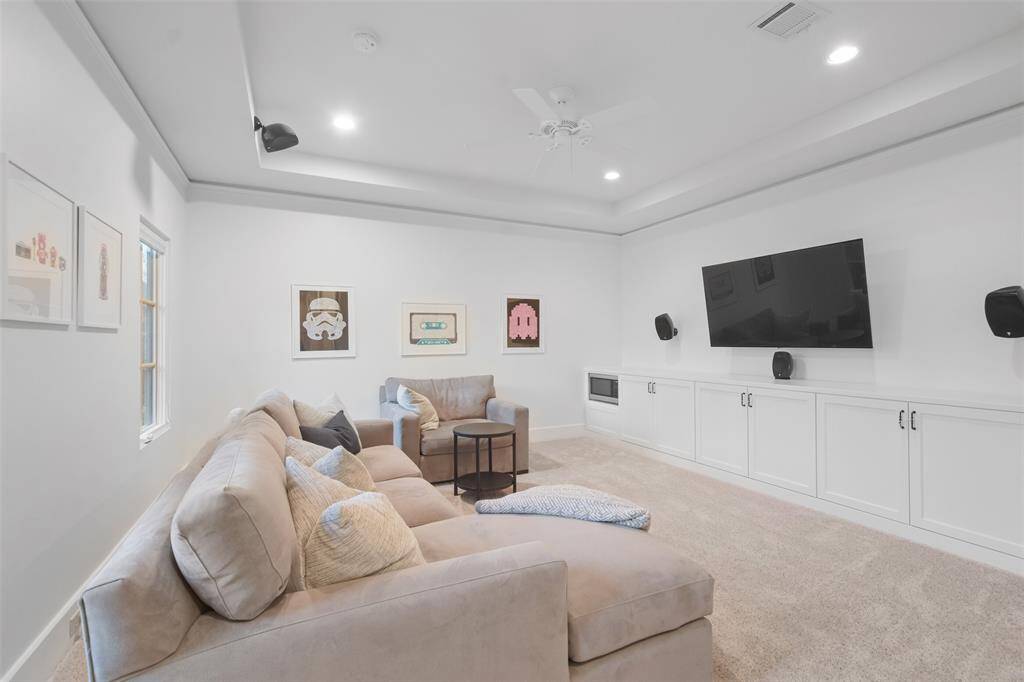 The spacious layout of the game room provides plenty of room for games, lounging, and watching movies making it the perfect spot for family and friends to come together. Surround sound speakers are seamlessly integrated into the space, delivering an immersive audio experience.