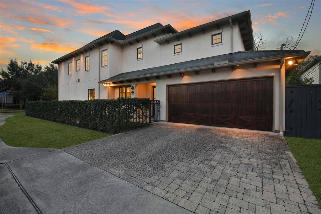 Situated on a corner lot, the home offers an additional side yard space and parking for guests at the garage driveway.