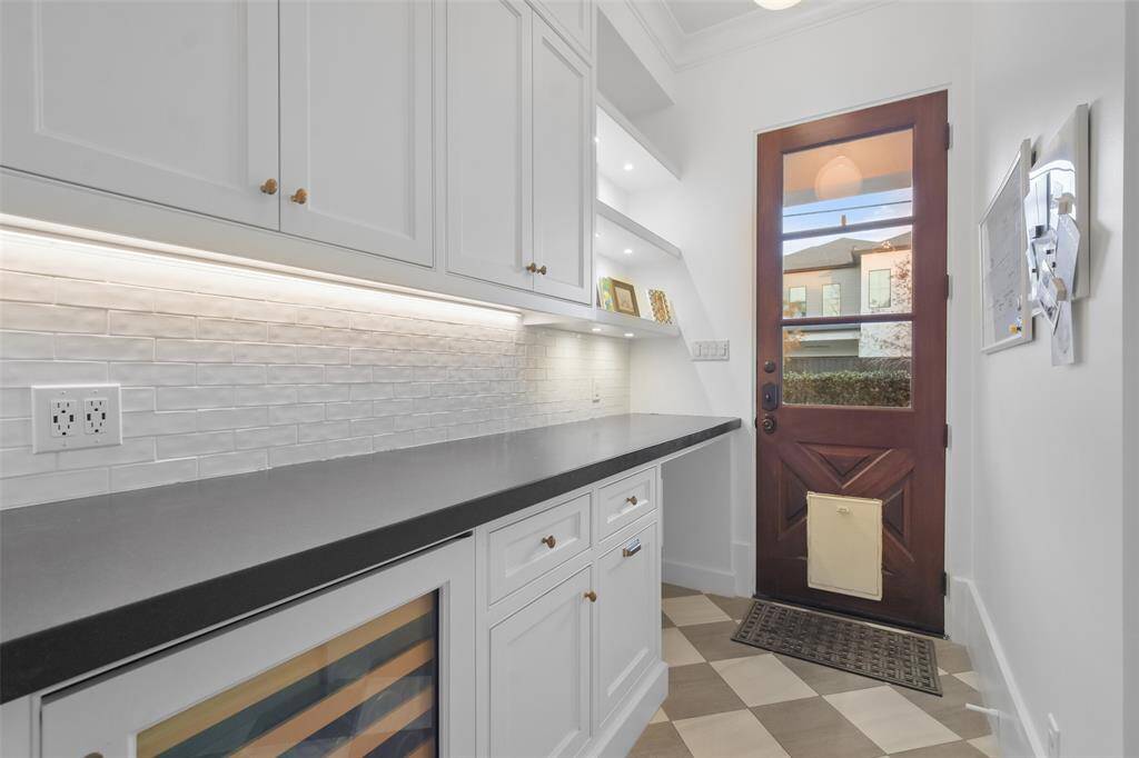 Bill pay station/E-space is located just off the mudroom with access to the side yard.