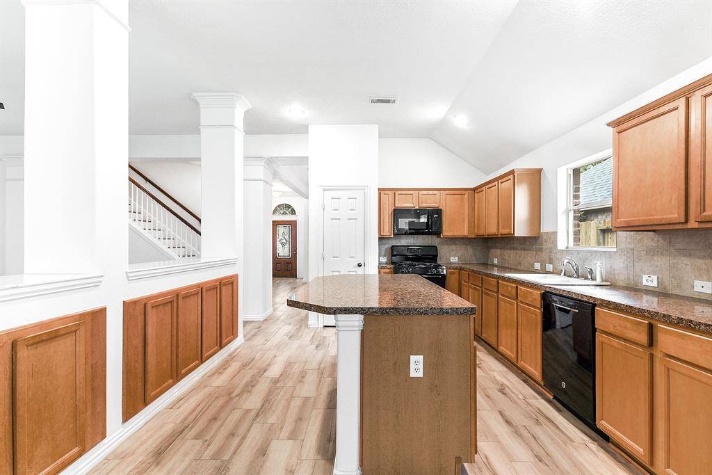 From the breakfast room, you have a view all the way to the front door and entryway, which were freshly painted and received new flooring in May 2025."