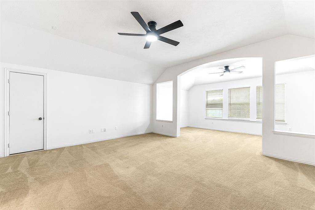 Upstairs offers a huge private space that’s perfect for a secondary en suite, game room, or media room providing an extra entertaining area on the second level, complete with a full bathroom. Door shown is to the built out attch space. great for extra storage space.