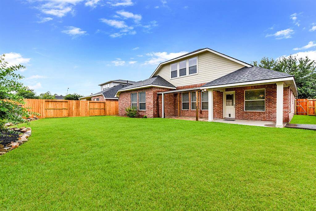 This spacious private backyard is perfect for families, offering plenty of room for outdoor activities and relaxation. The lush, green grass is low-maintenance, and the beautifully landscaped yard provides year-round appeal.