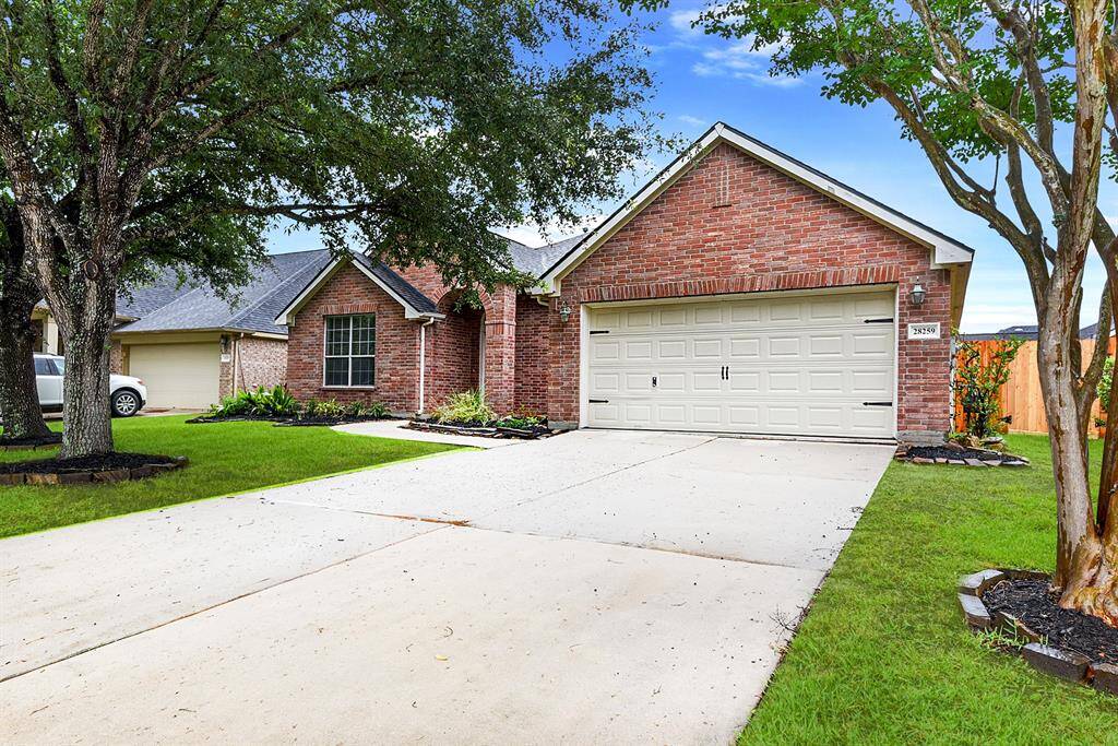 This home offers stunning curb appeal with meticulously manicured landscaping, located on a quiet street with minimal traffic. The expansive driveway leads to a two-car garage, offering both convenience and ample parking space in the drive way.