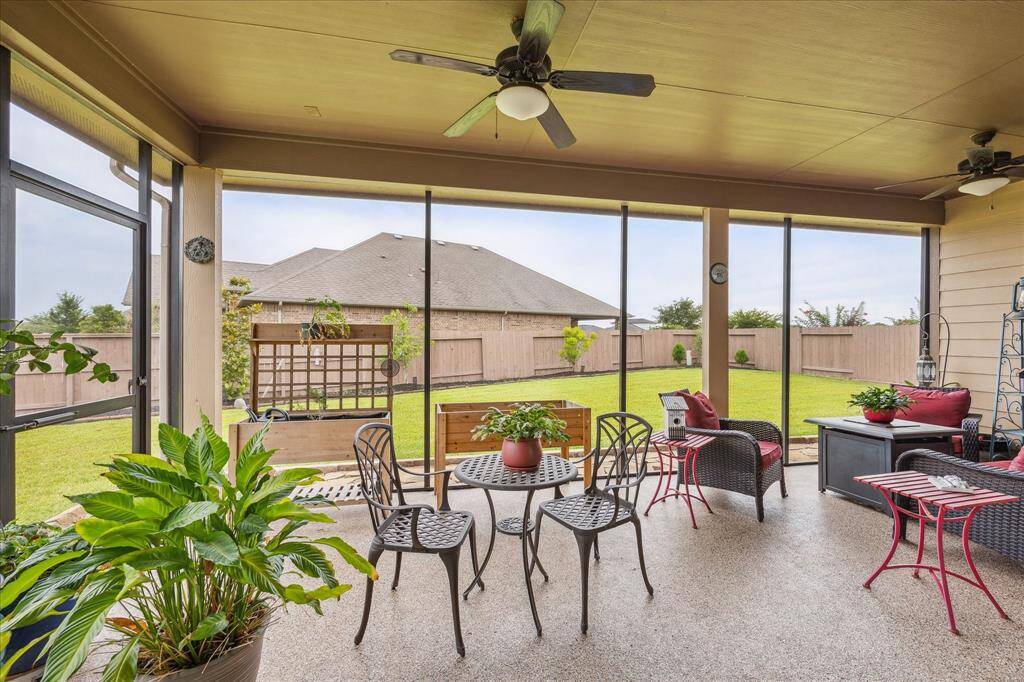 Alfresco living and entertaining doesn't get any better than this!  This lovely covered screened-in patio boasts another seller upgrade, epoxy flooring & a gas connection for a future outdoor kitchen.  Adding to your comfort are two ceiling fans.