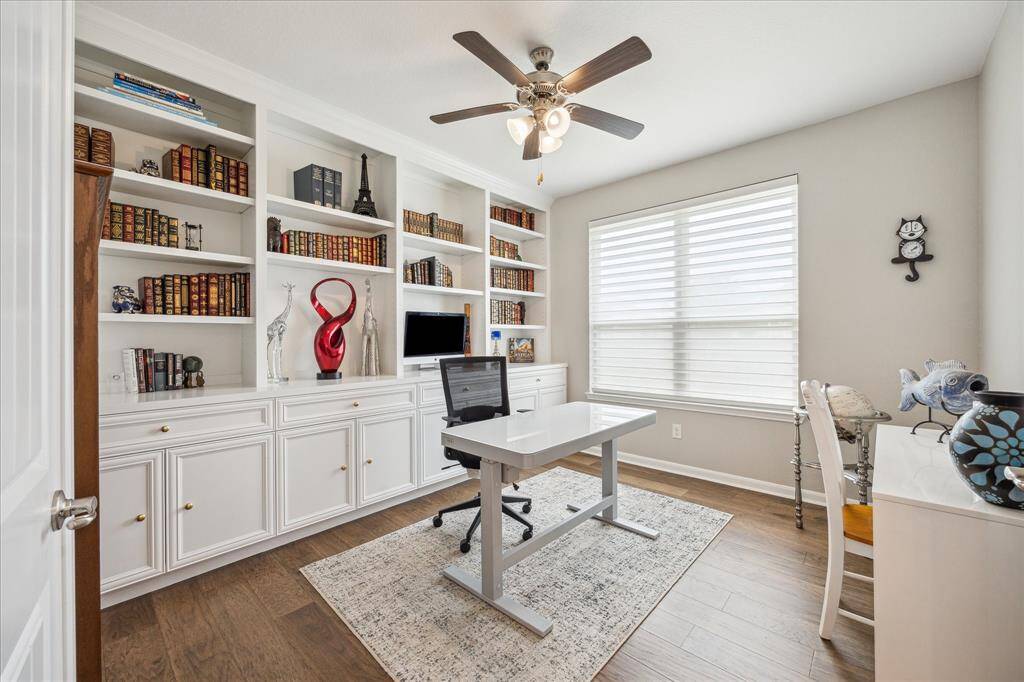 The study/home office boasts recently installed built-ins, wood flooring, ceiling fan and a nice sized window overlooking the side yard.  This room could easily be used as a third bedroom for guests.