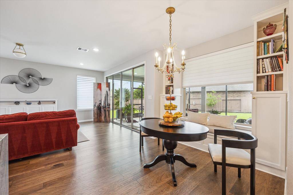The current sellers added a charming built-in banquette with custom cushions in the breakfast room.  Note the attractive built in bookcases that flank the banquette providing nice display space and storage.