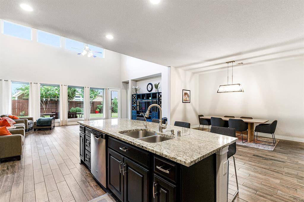 Enjoy lovely views of the entire home and even the backyard while working in the kitchen or hosting guests. Across from the kitchen is a spacious formal dining room, offering convenient access for entertaining