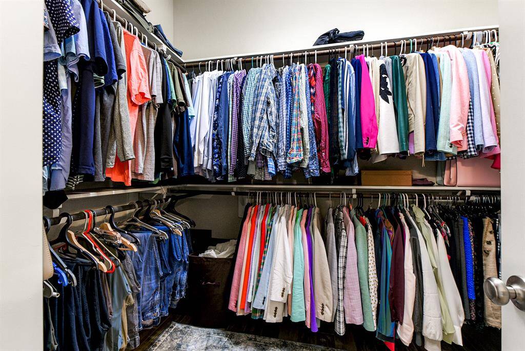 A huge wardrobe closet offers plenty of space for all your storage needs, complete with shelving and hanging rods for optimal organization.