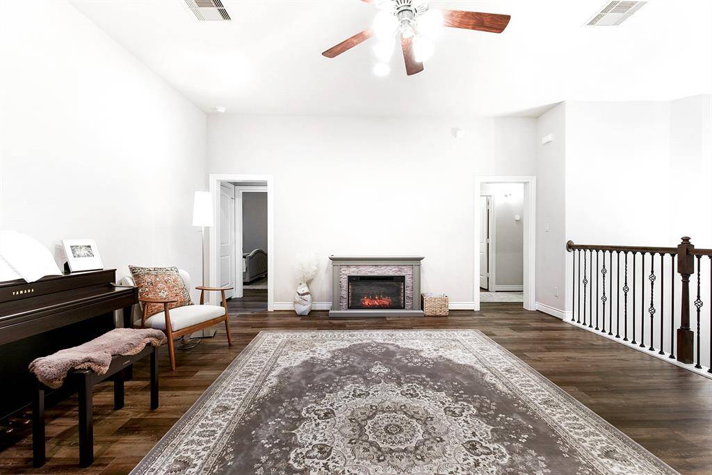The upper level features a well-designed split floor plan, with guest bedrooms on one side and a spacious game room on the other. It’s a fantastic and functional layout!