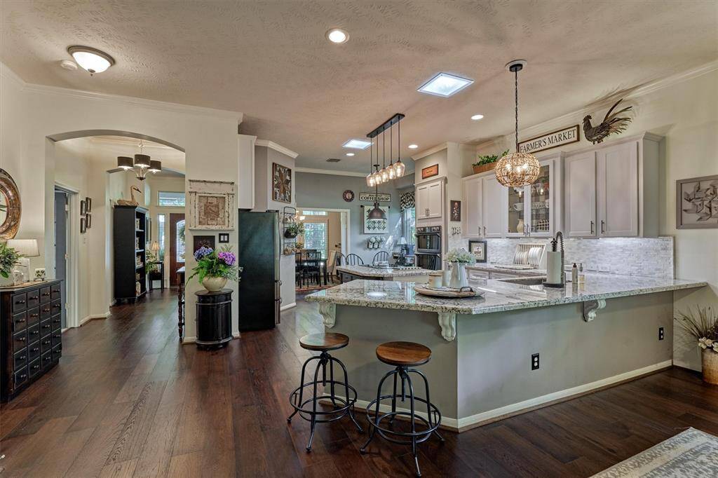This charming home oozes with character and comfortable flow! Note the upgraded light fixtures throughout!