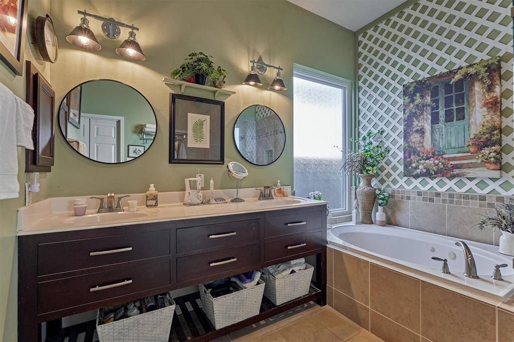 Storage abounds in this prep area with built-in medicine cabinet and vanity space.