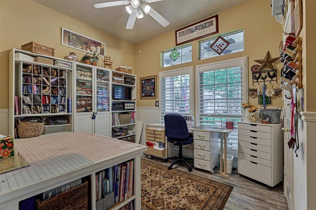 Bedroom 3, used here as an impressive sewing retreat, overlooks the tranquil front porch.