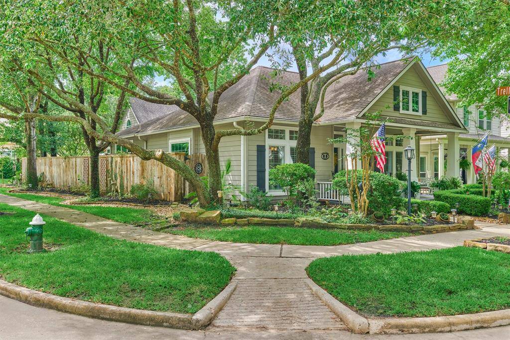 Stunning corner lot showcases bonus privacy, side yard, and more!