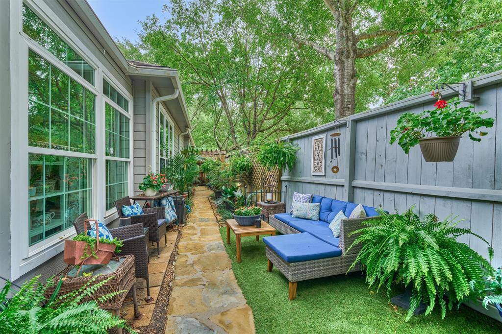 Painted fence is pleasing to the eye and blends nicely with the outdoor aesthetic here.