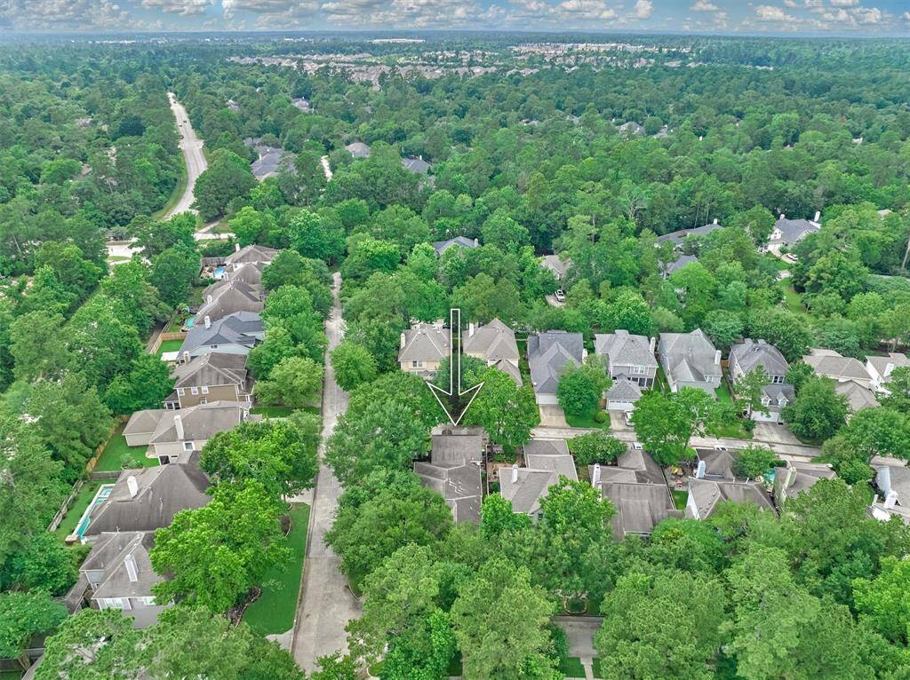 Surrounded by mature trees, 3 Ivy Garden sits on a generous corner lot in sought-after Cottage Green!