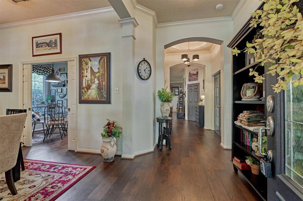 Craftsman beauty offers continuous engineered wood floors throughout the main living area and deep moldings for added appeal.