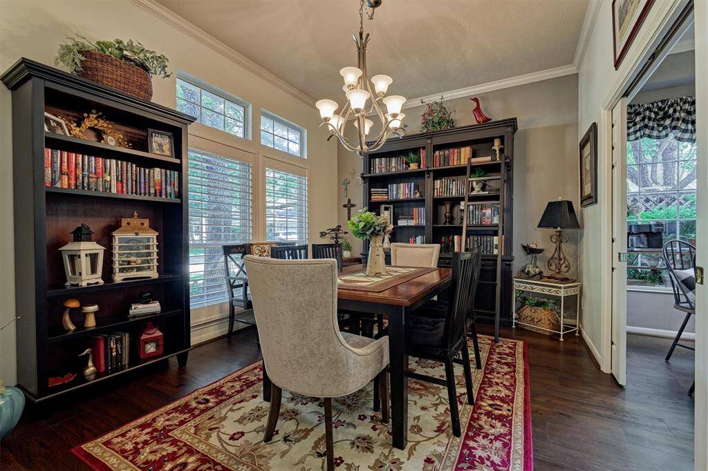 Spacious dining room overlooks the idyllic front yard and features double pocket door access to the breakfast room and kitchen.