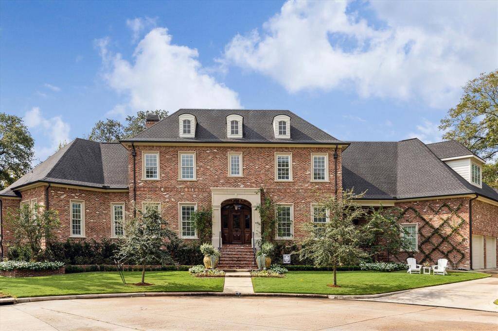 Another view of this superlatively designed & constructed home in the heart of Memorial, boasting exquisite finishes, 4-car garage, spacious workshop & expansive yard with plenty of room for a pool!