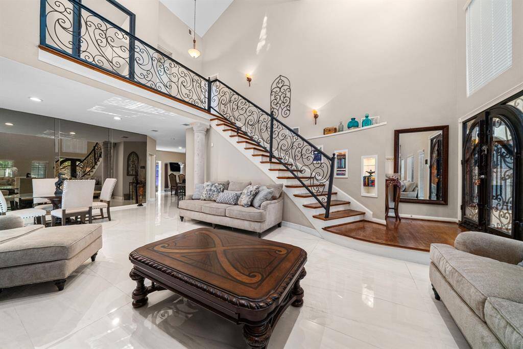 Recently installed porcelain floors mixed with the high ceilings give the space such a big feel