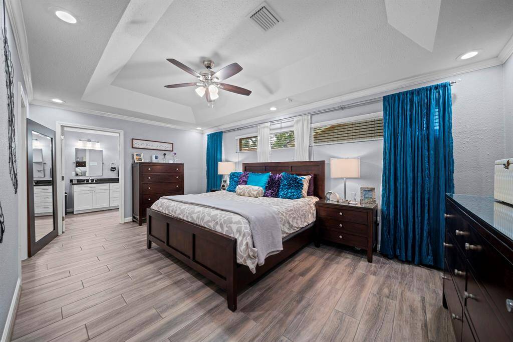 The primary suite is tucked in the back of the home with in suite bathroom