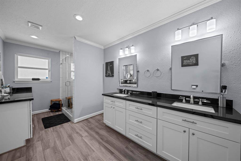 Separate vanity and double sinks provides all the countertop space you could need