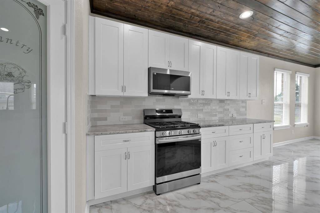 Kitchen and breakfast area on the right.