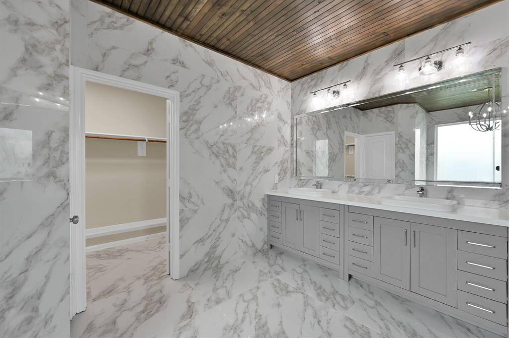 Primary Bath with double sinks and huge mirror.