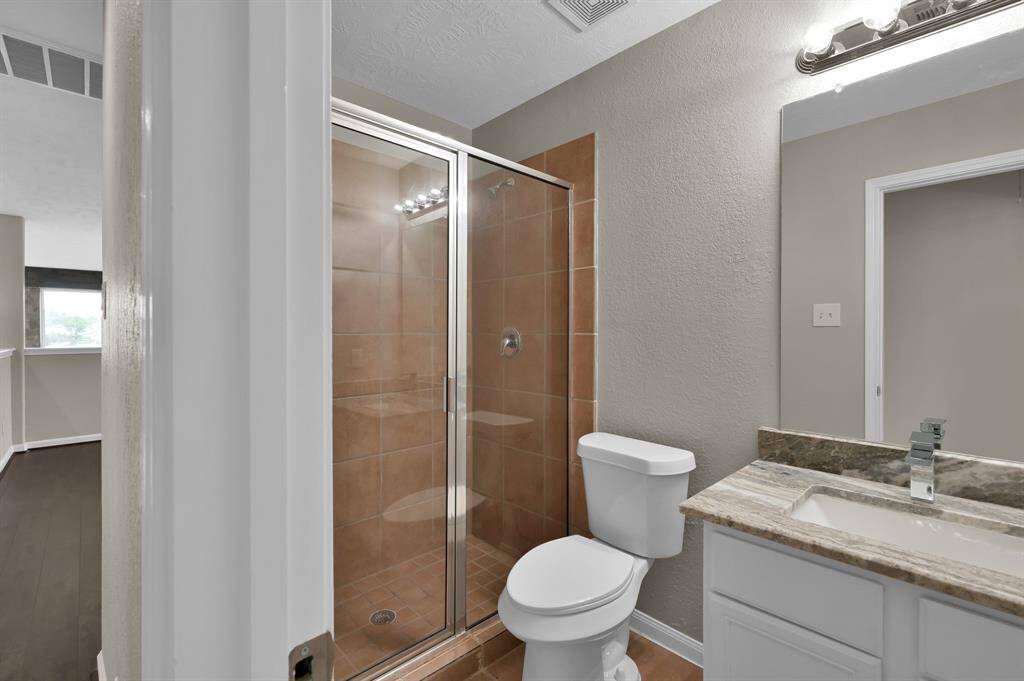 Second Bathroom, complete with shower and tub combination.
