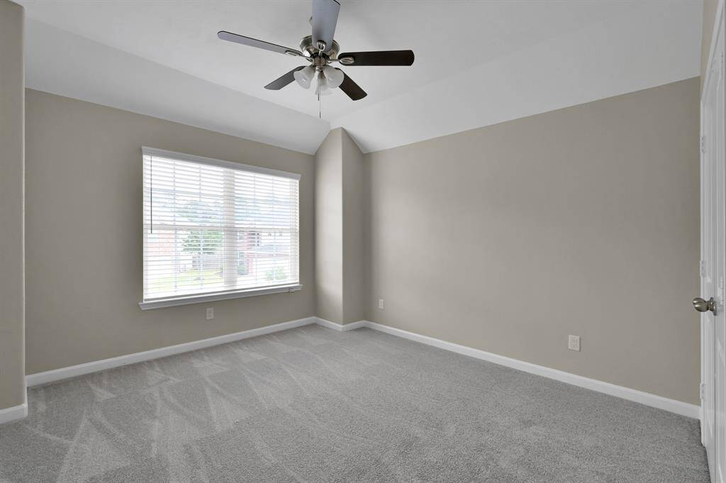 Bedroom 4 with ceiling fan.