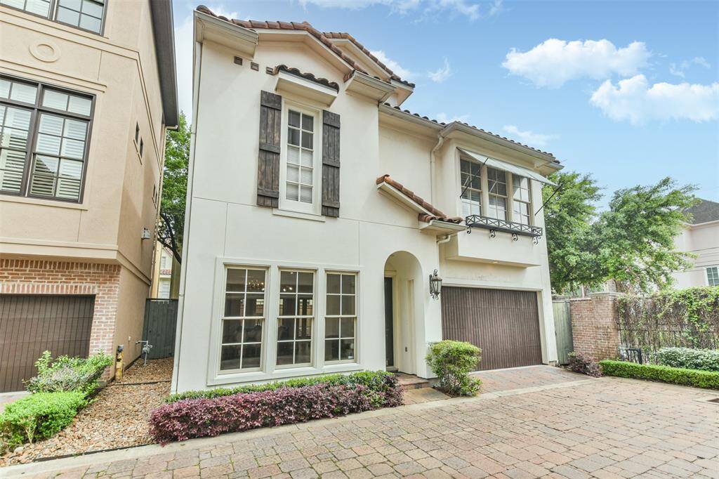With its perfectly manicuredlandscaping, tile roof, rusticshutters, and private gateddriveway, this home exudestimeless curb appeal in a serenecommunity setting