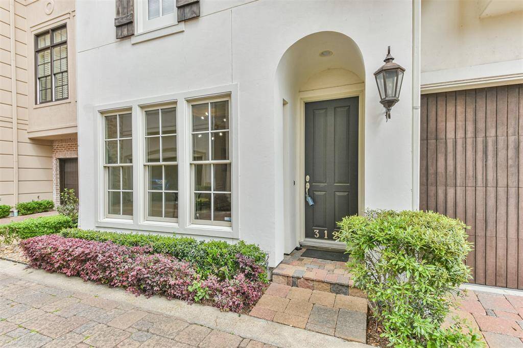 Boasting a charming front entrywith covered porch and lushlandscaping, creating a warmand inviting welcome for guests.