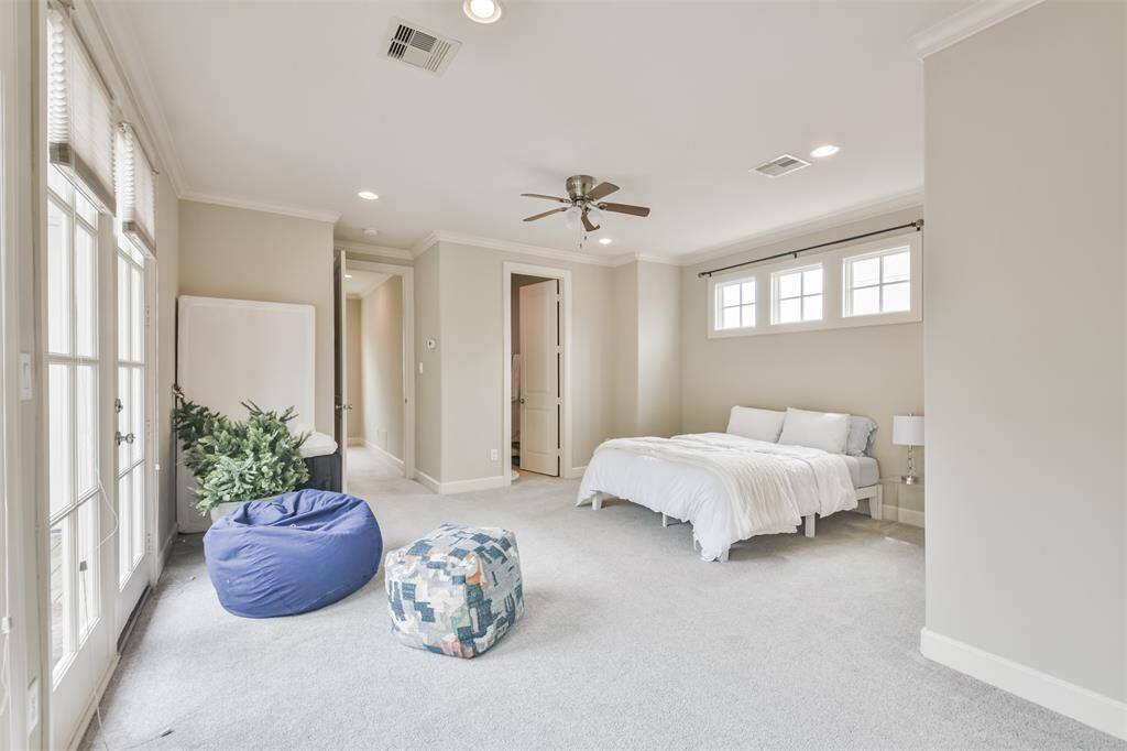 Bright and spacious, this topfloor suite boasts natural light,plush carpet, ensuite bathroom,and direct access to the privatepatio—ideal for guests or agame room.