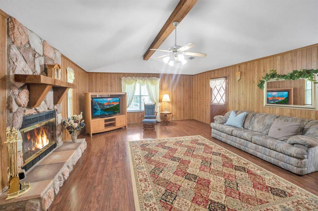 oversized den with woodburing fireplace