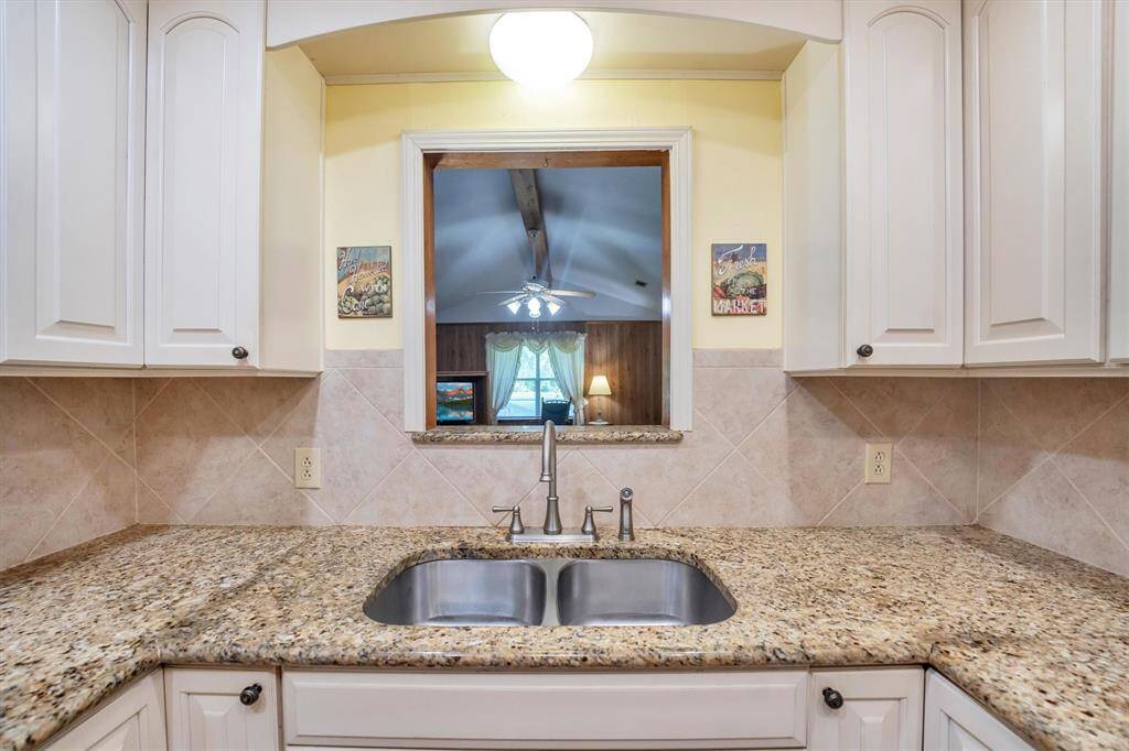 Kitchen sink looking into den