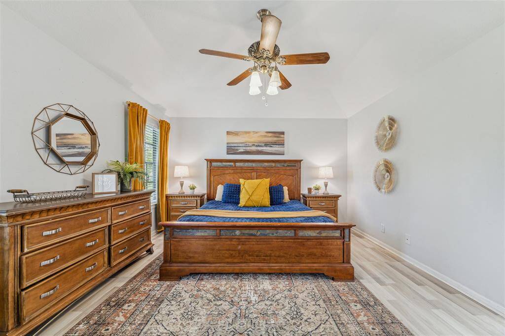 The owners retreat, located downstairs, features an updated spa-like ensuite bathroom.