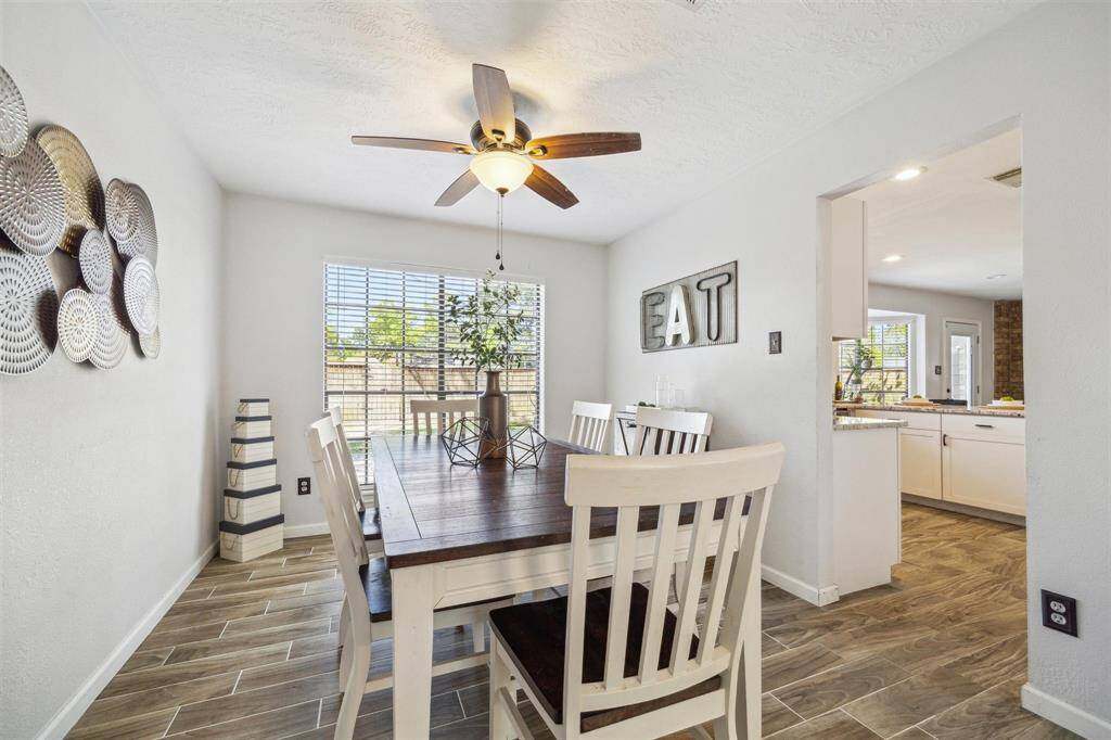 The dining area features a cozy, bright space open to a spacious kitchen creating an inviting flow for entertaining.
