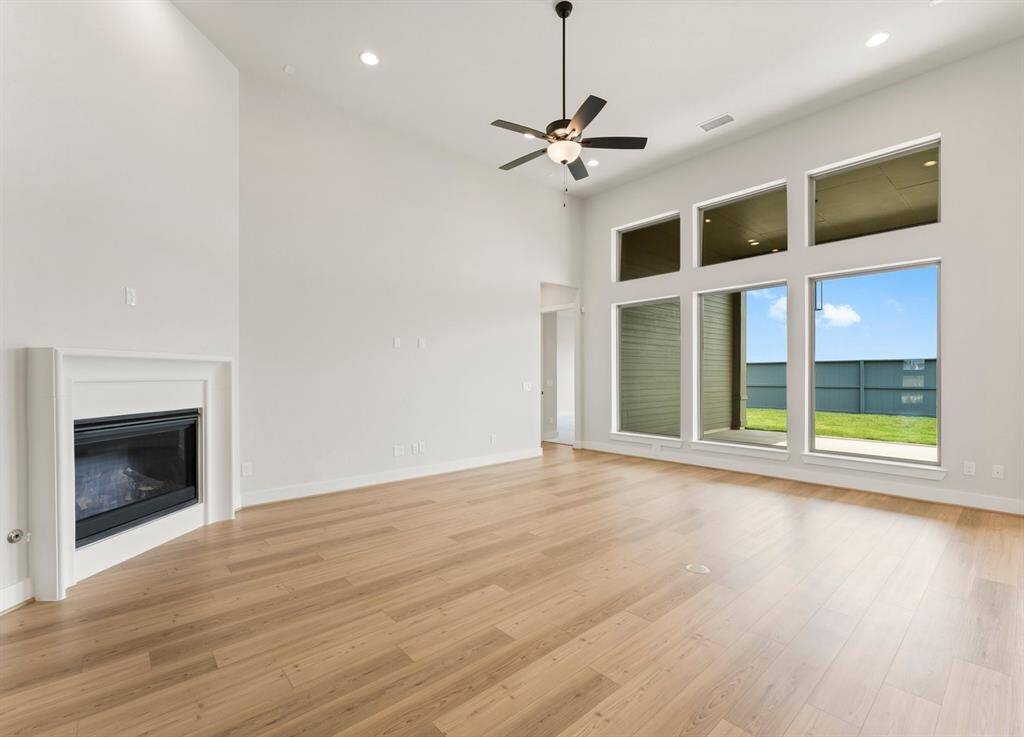 Great Room with 14' Ceiling, Gas-Log Fireplace, and Tall Windows