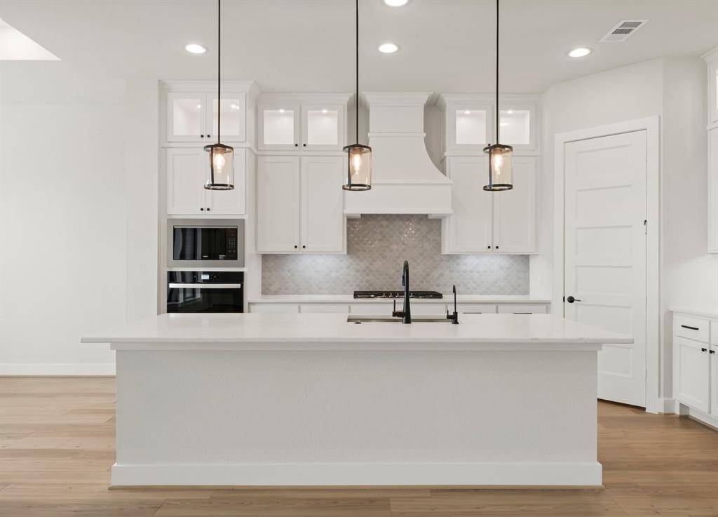 Gorgeous Kitchen with Cabinets to the Ceiling and Undercabinet Lighting