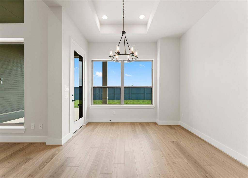 The Breakfast Area is Open to the Kitchen and Offers Access to the Covered Rear Patio