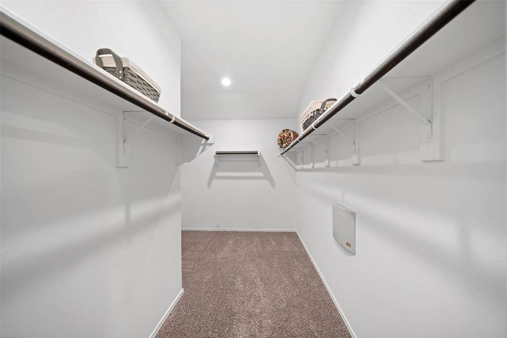 Massive Primary closet that takes at left corner at the end for more storage!