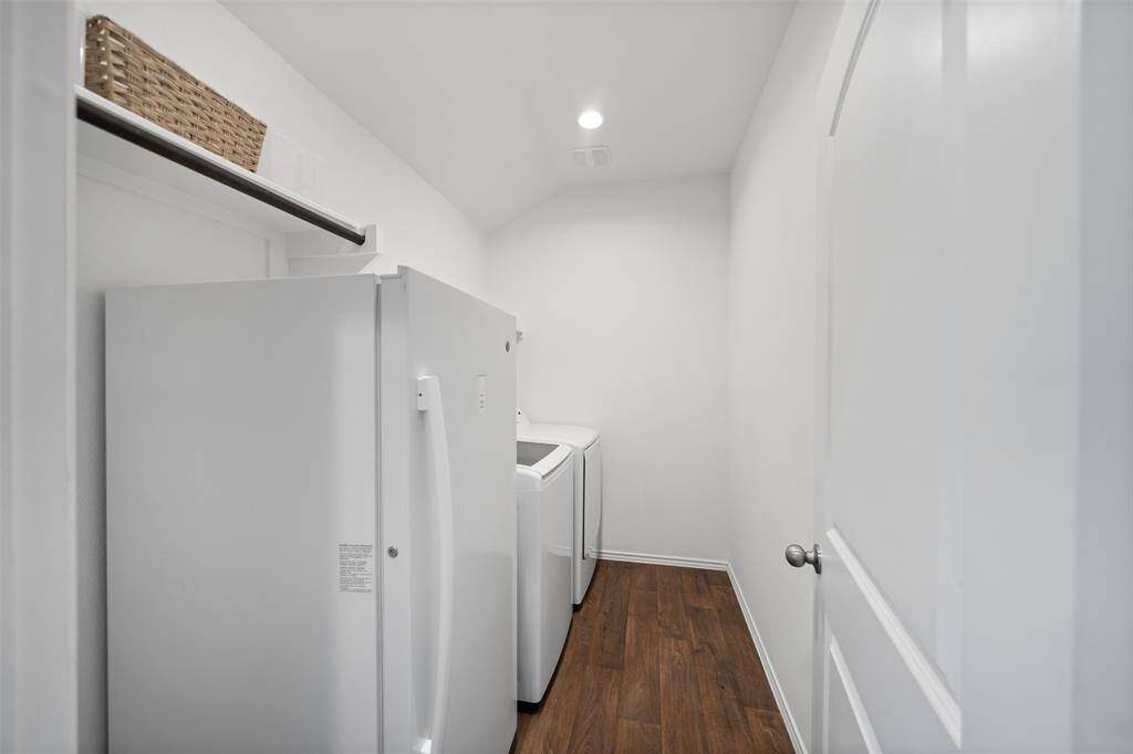 Utility room comes equipped with washer/dryer and stand up freezer.